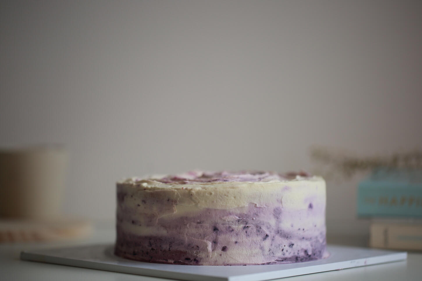 Flat lay of purple sweet potato cake styled in natural light for food photography