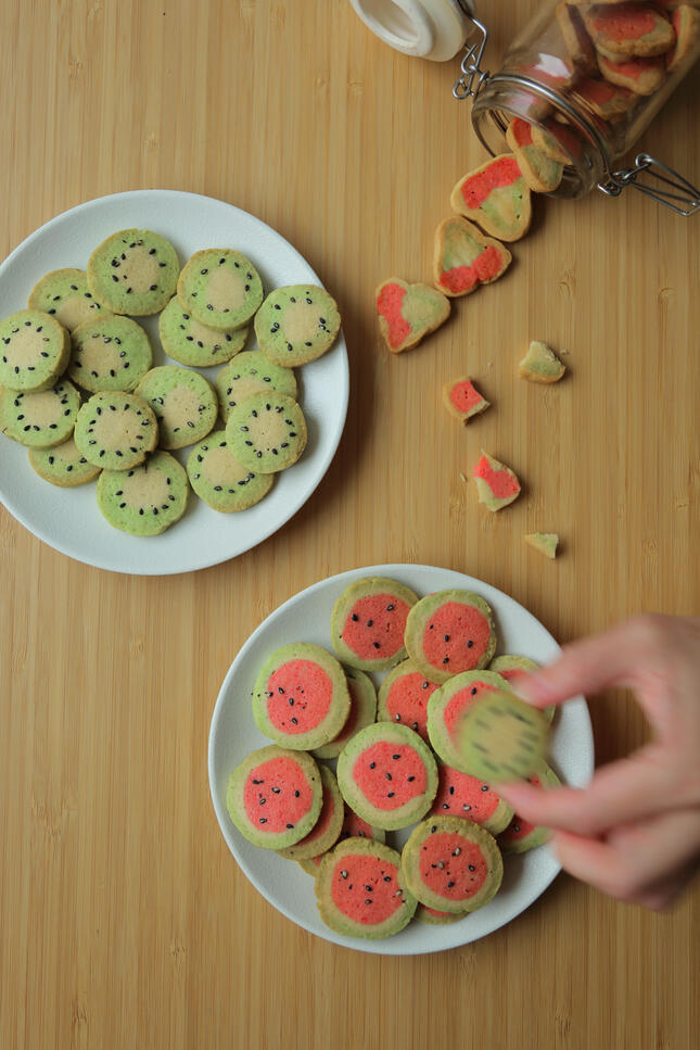 Matcha cookies arranged on plate in natural light flat lay composition